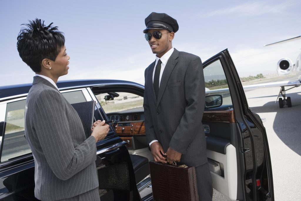 limo driver talking with his executive guest